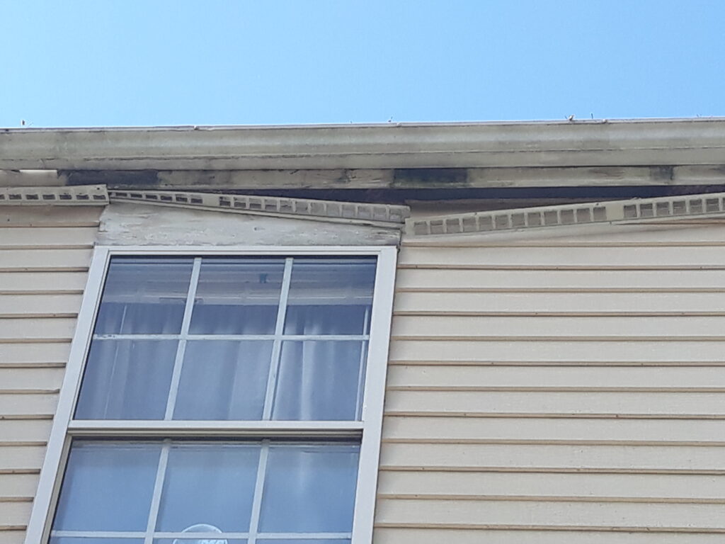soffit damage from water behind gutter