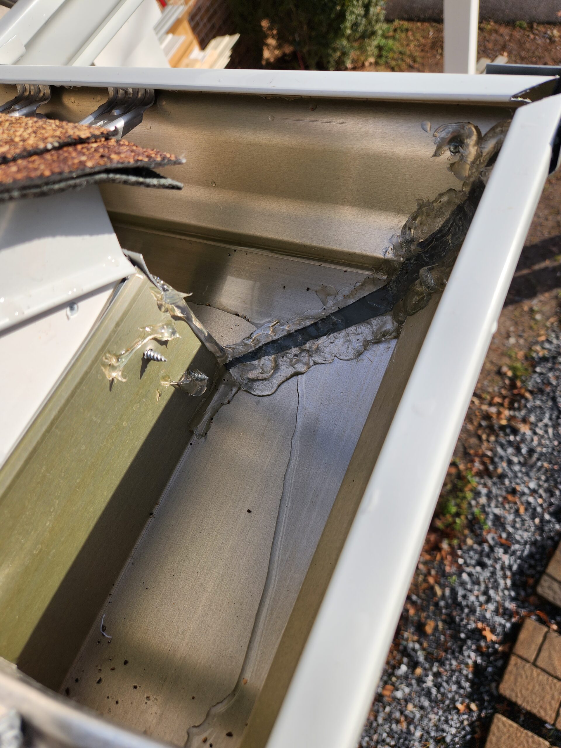 gutter slope issues cause water to collect in gutter corner