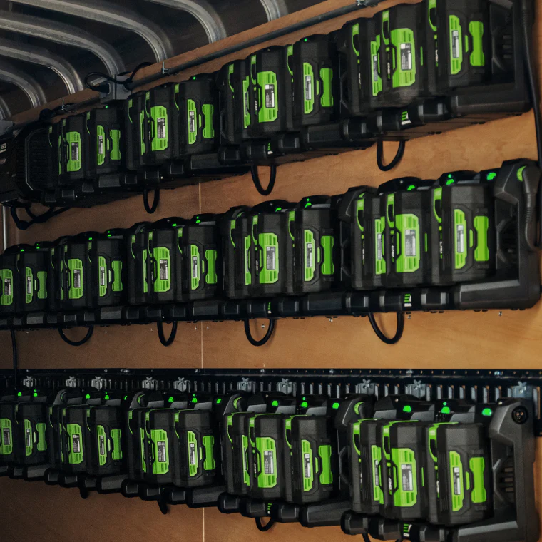 electric leaf blower battery charges mounted to wall