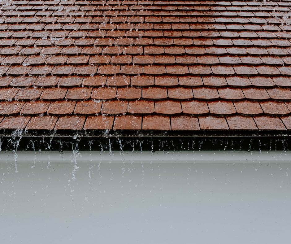 water speeding down a tile roof