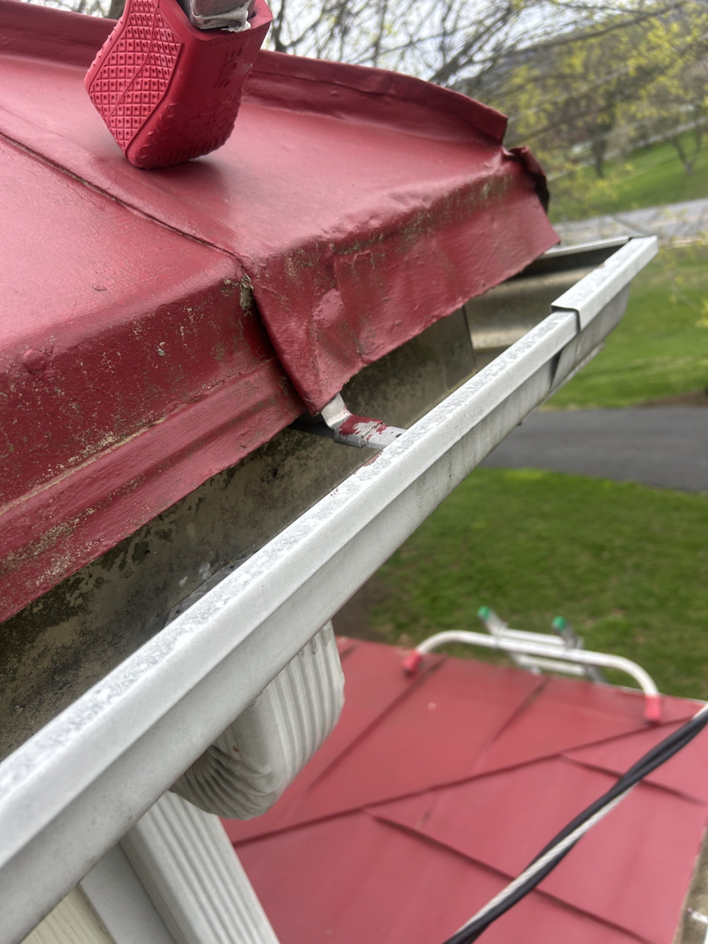 excessive metal roof overhang prevents gutter guards from being installed