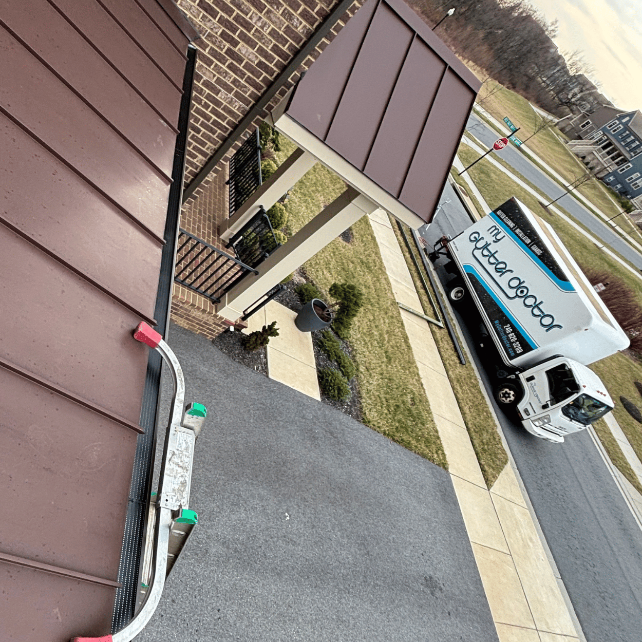 double-pro gutter guard systems installed under brown metal roof 2