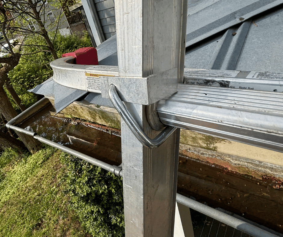 standing water in gutter corner caused by slope issue