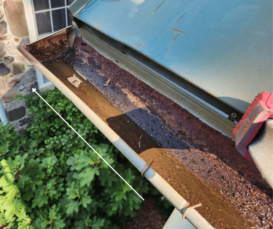 water in high end of half round gutter causing gutter rust